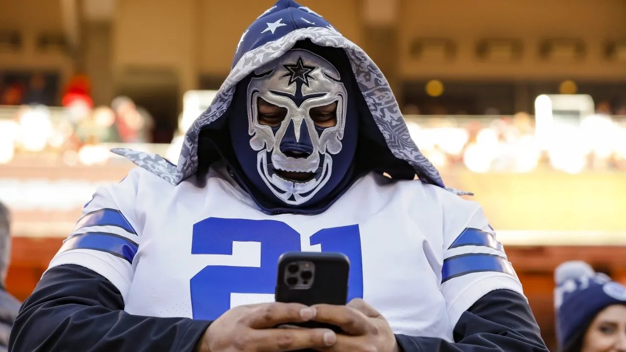 Cowboys fan on phone