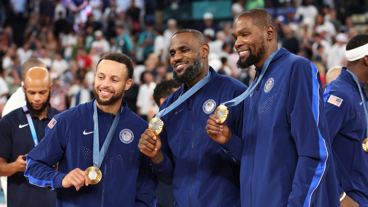 Stephen Curry, LeBron James and Kevin Durant pose with their Olympic gold medals