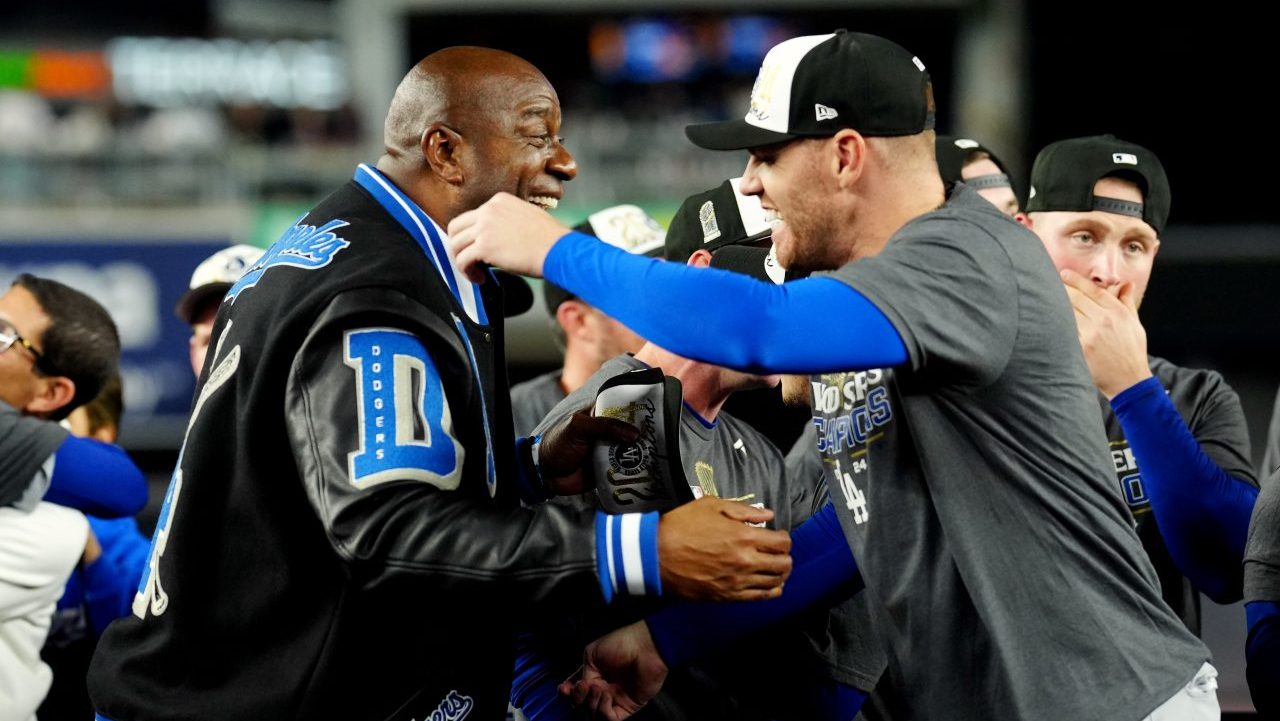 Magic Johnson hugs Freddie Freeman after World Series