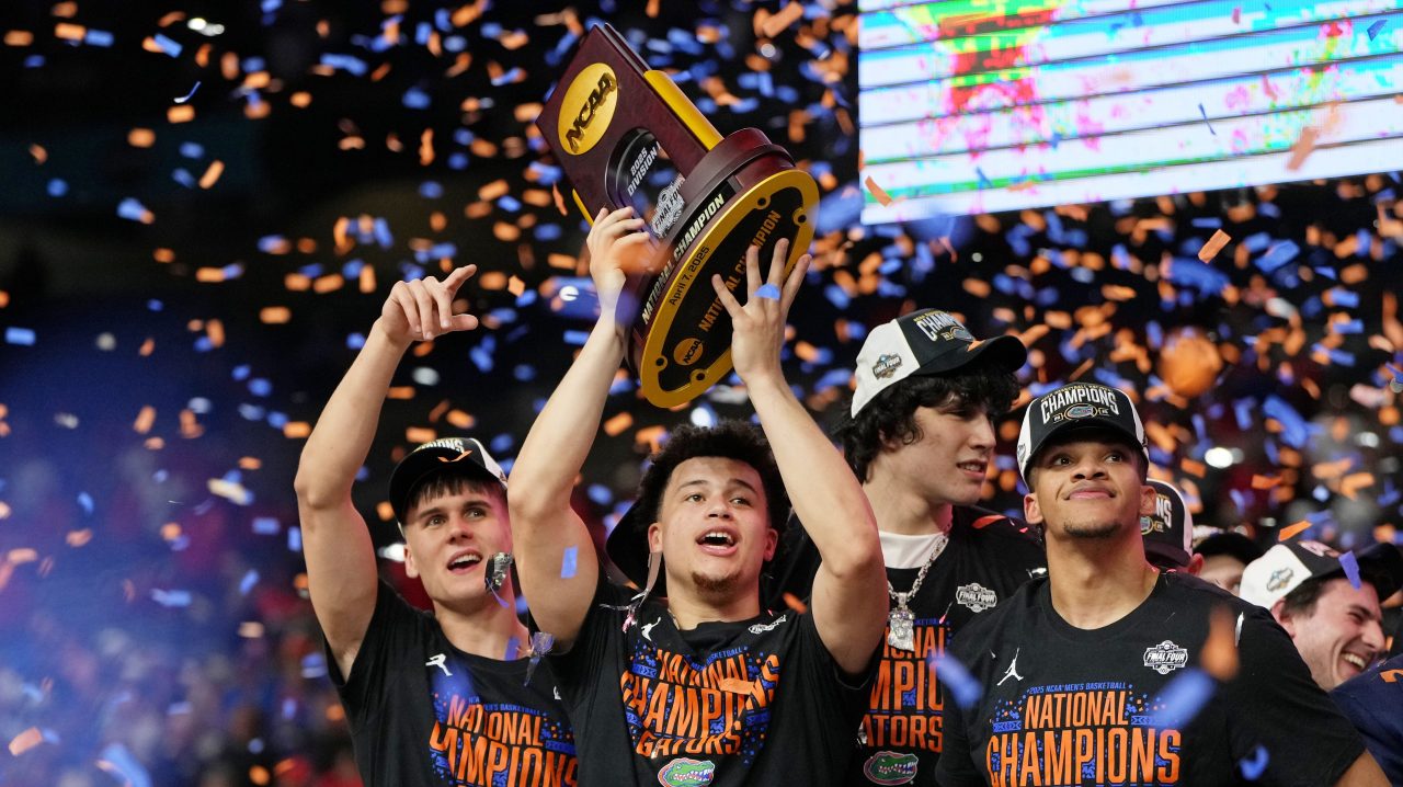 Florida's Walter Clayton Jr. holds up championship trophy